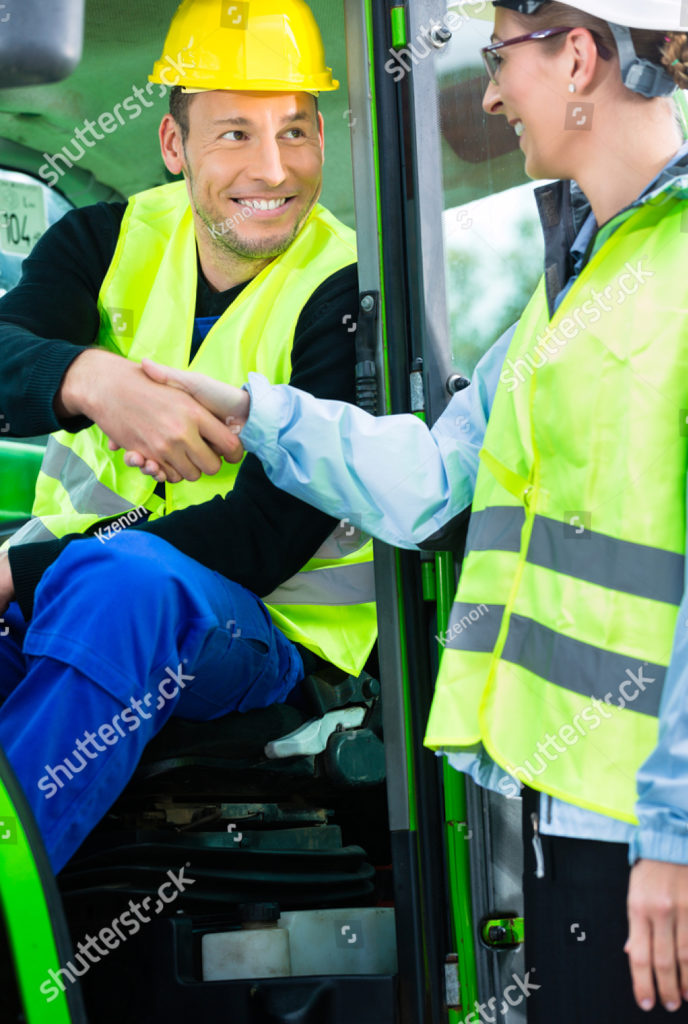 stock-photo-construction-worker-in-construction-machinery-hand-shake-with-engineer-to-welcome-on-construction-177409469